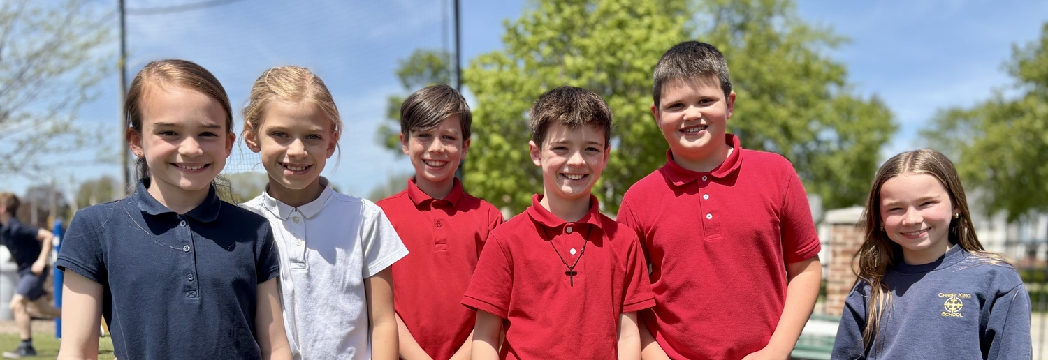 Christ King School students smiling.